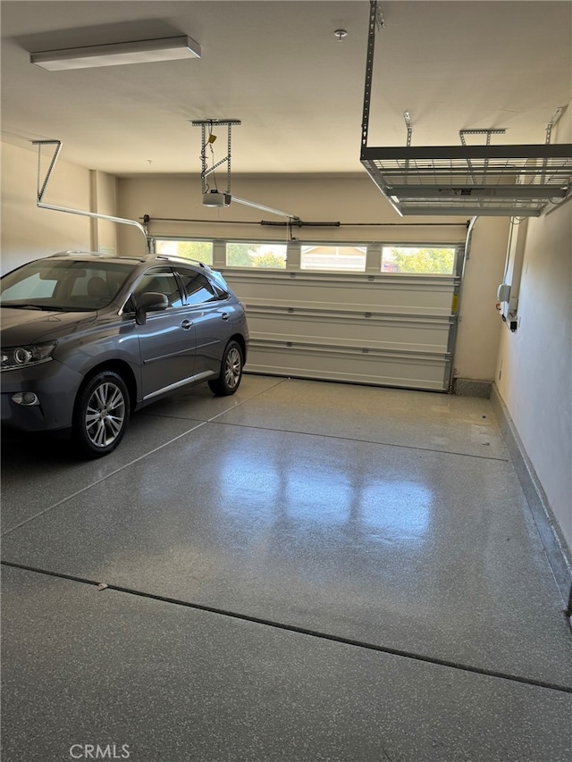 garage featuring a garage door opener