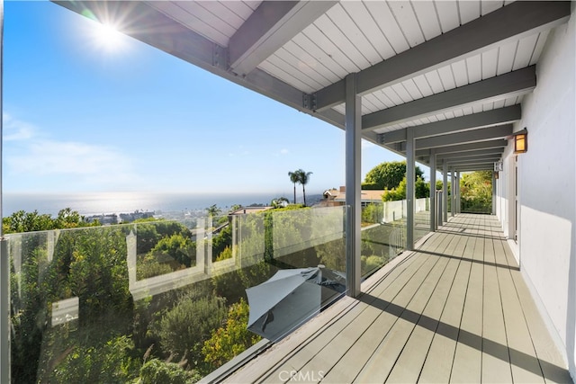 wooden deck with a water view