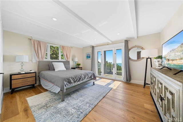 bedroom with beamed ceiling, light hardwood / wood-style floors, access to exterior, and multiple windows