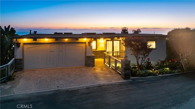 view of front of property featuring a garage