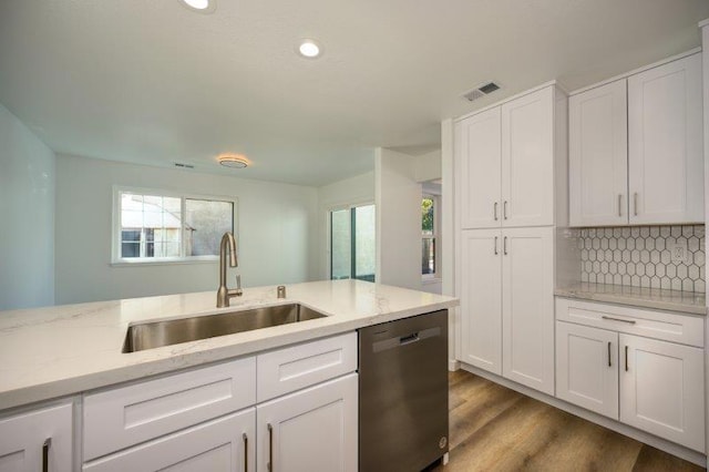 kitchen featuring white cabinetry, sink, stainless steel dishwasher, and dark hardwood / wood-style floors