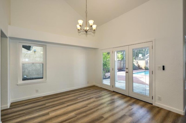 interior space with french doors, a healthy amount of sunlight, and dark hardwood / wood-style floors