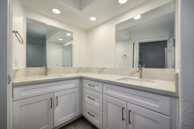 bathroom with vanity and tile patterned flooring