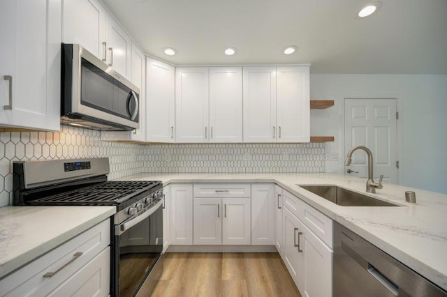 kitchen with stainless steel appliances and white cabinets