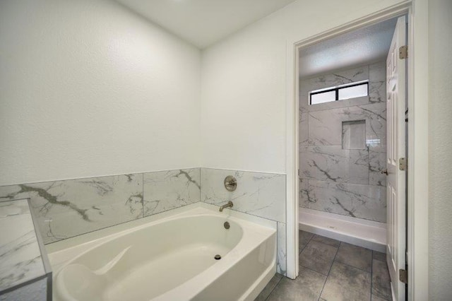 bathroom featuring shower with separate bathtub and tile patterned flooring