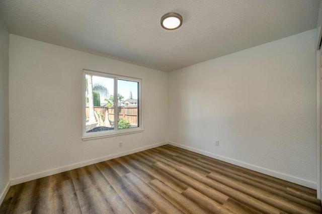 empty room featuring hardwood / wood-style floors