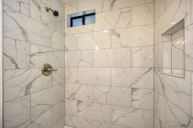 bathroom with tiled shower