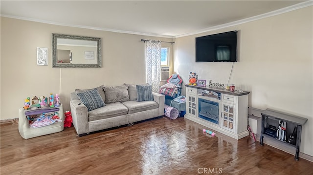 living room with crown molding and hardwood / wood-style floors