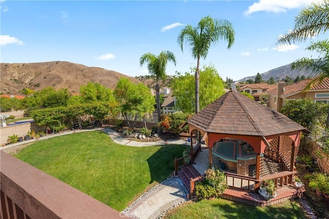 view of yard featuring a gazebo and a mountain view