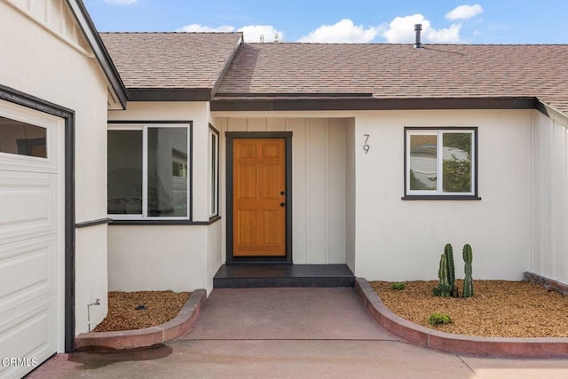 view of exterior entry featuring a garage