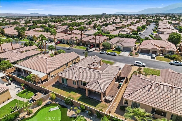 birds eye view of property with a mountain view