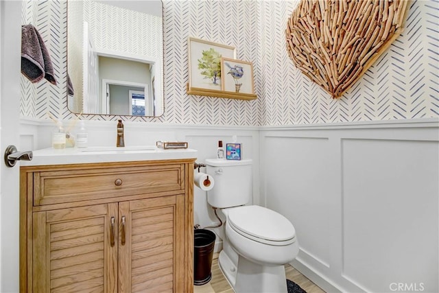 bathroom with toilet and vanity