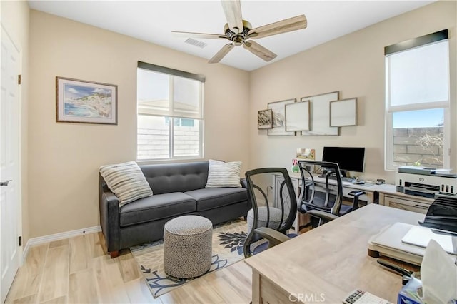 office featuring ceiling fan and light hardwood / wood-style floors