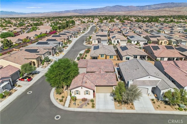 birds eye view of property featuring a mountain view