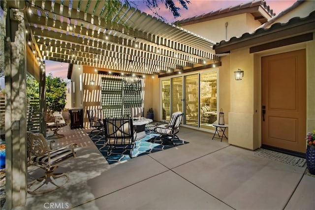 patio terrace at dusk with a pergola