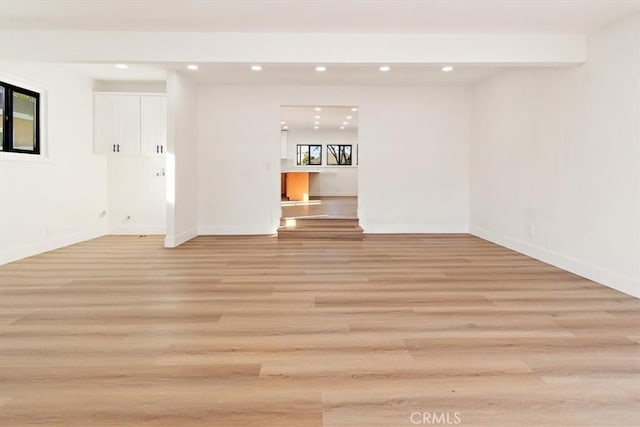 spare room featuring light wood-type flooring