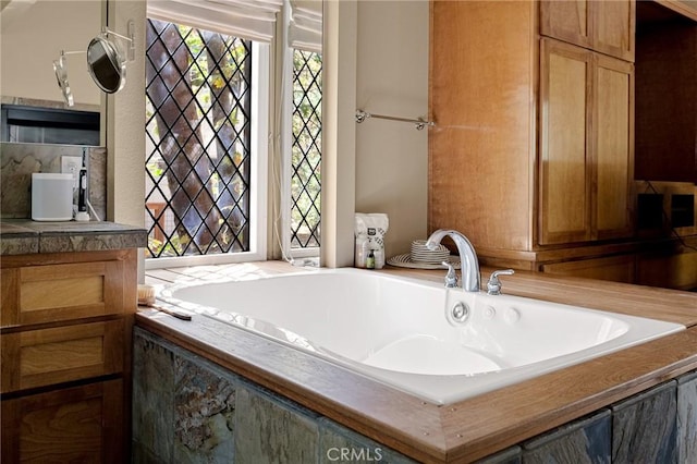 bathroom featuring sink and a bathing tub