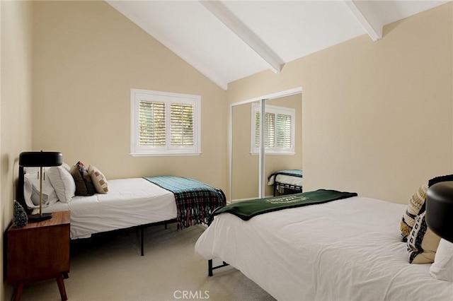 bedroom featuring carpet flooring and vaulted ceiling with beams