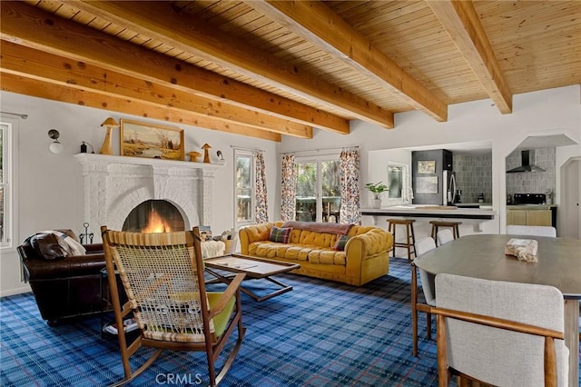 living room featuring wood ceiling, carpet floors, beamed ceiling, and a fireplace