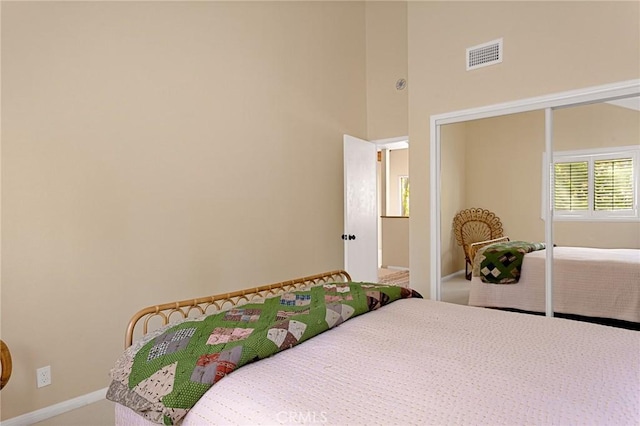 carpeted bedroom featuring a closet