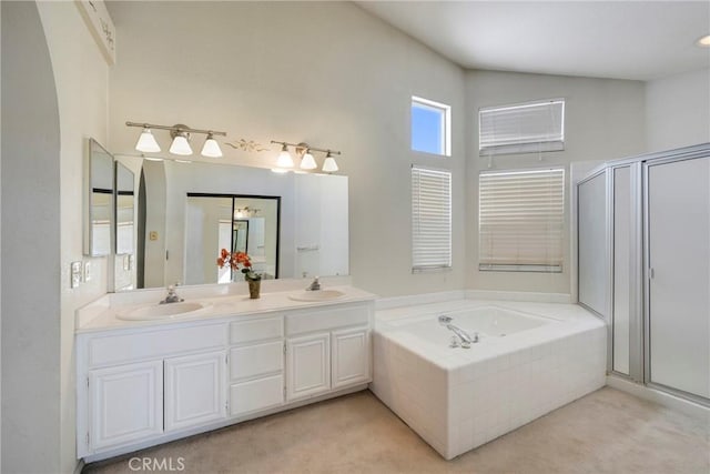 bathroom featuring independent shower and bath and vanity