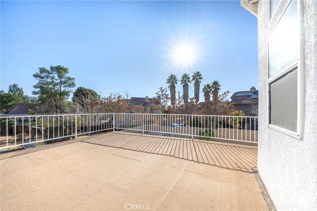 view of patio with a balcony