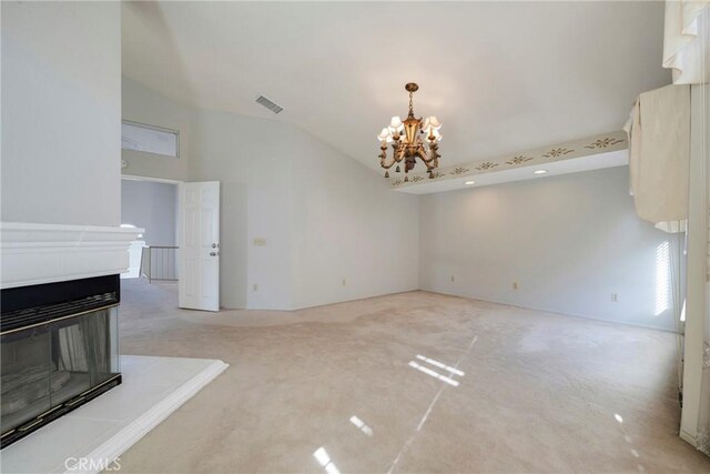 unfurnished dining area with light colored carpet, lofted ceiling, a chandelier, and a multi sided fireplace