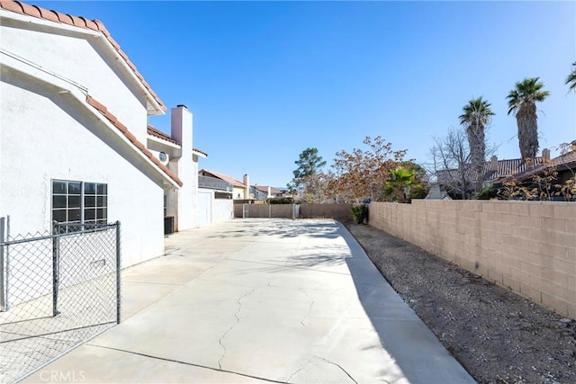 view of patio / terrace featuring fence