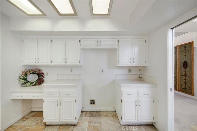 laundry room with laundry area and baseboards