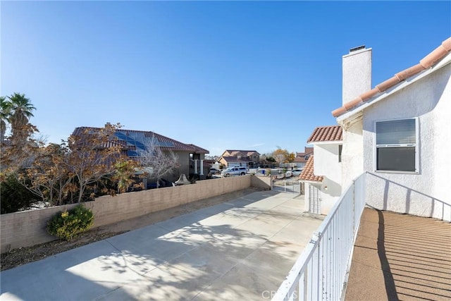 view of patio / terrace with a fenced backyard and a residential view