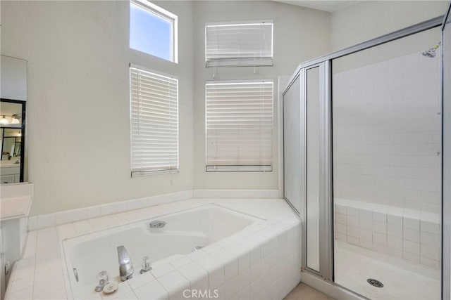 full bathroom with a garden tub and a shower stall