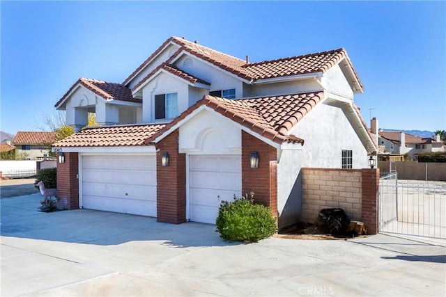 mediterranean / spanish home featuring a garage