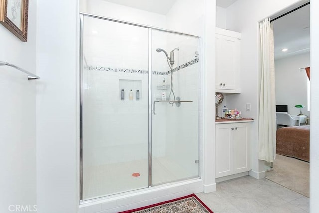 bathroom featuring tile patterned floors and walk in shower