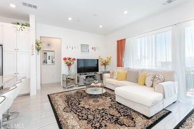 living room with light tile patterned floors