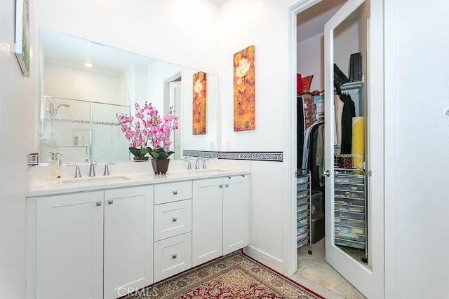 bathroom featuring vanity and walk in shower