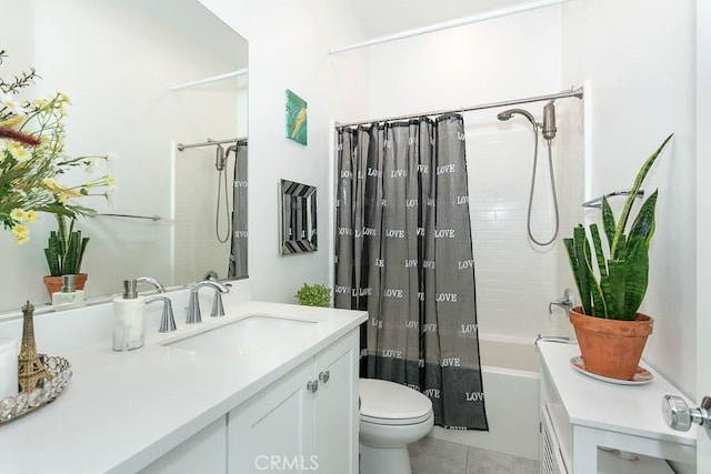 full bathroom featuring tile patterned floors, vanity, toilet, and shower / tub combo