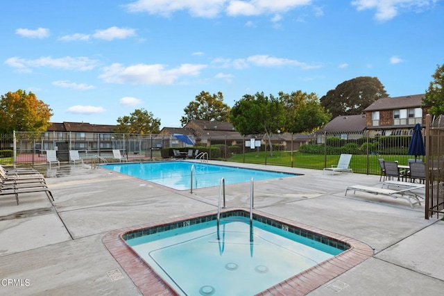 view of pool featuring a yard and a patio area