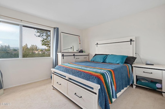 bedroom featuring light colored carpet