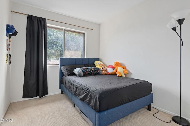 bedroom with light colored carpet