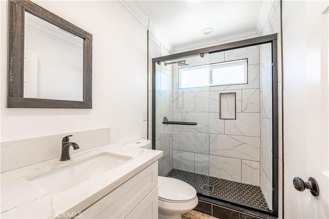 bathroom with vanity, toilet, crown molding, and walk in shower