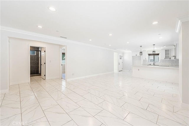 empty room featuring ornamental molding