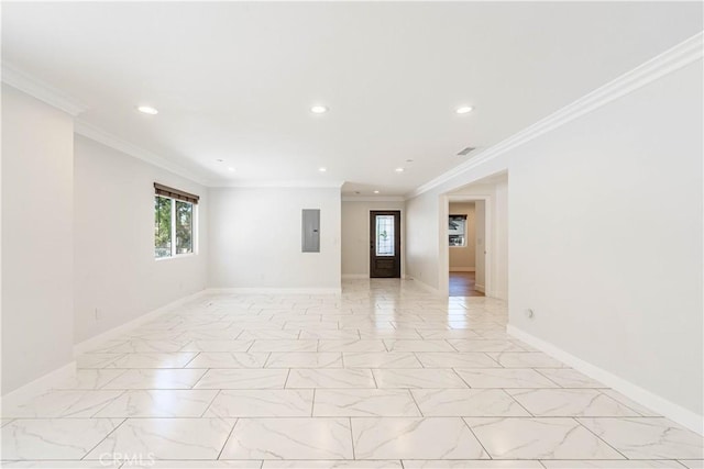 spare room with crown molding and electric panel