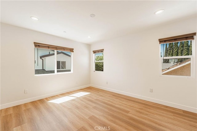 spare room featuring light hardwood / wood-style flooring