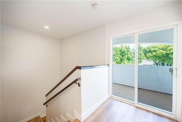 stairway featuring wood-type flooring