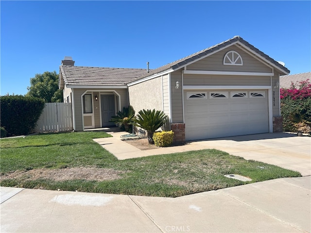 single story home featuring a garage and a front lawn