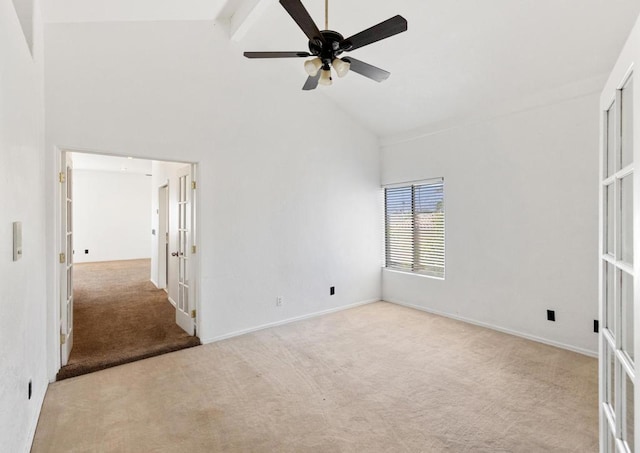 carpeted spare room with ceiling fan, high vaulted ceiling, french doors, and beamed ceiling