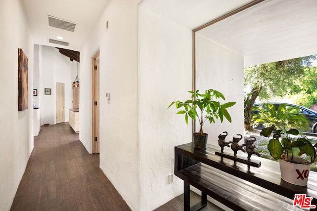 hallway with dark hardwood / wood-style floors