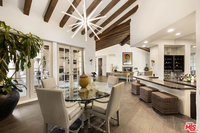 dining room with an inviting chandelier, french doors, hardwood / wood-style flooring, bar, and beam ceiling