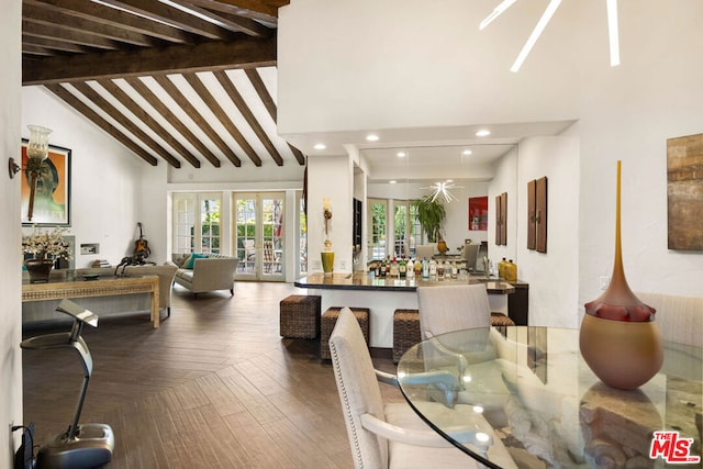 dining room featuring beam ceiling, high vaulted ceiling, and french doors