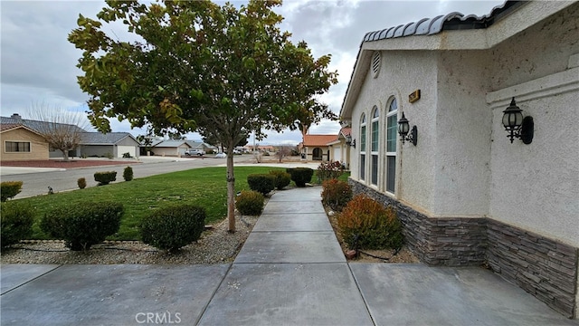 view of home's exterior featuring a lawn